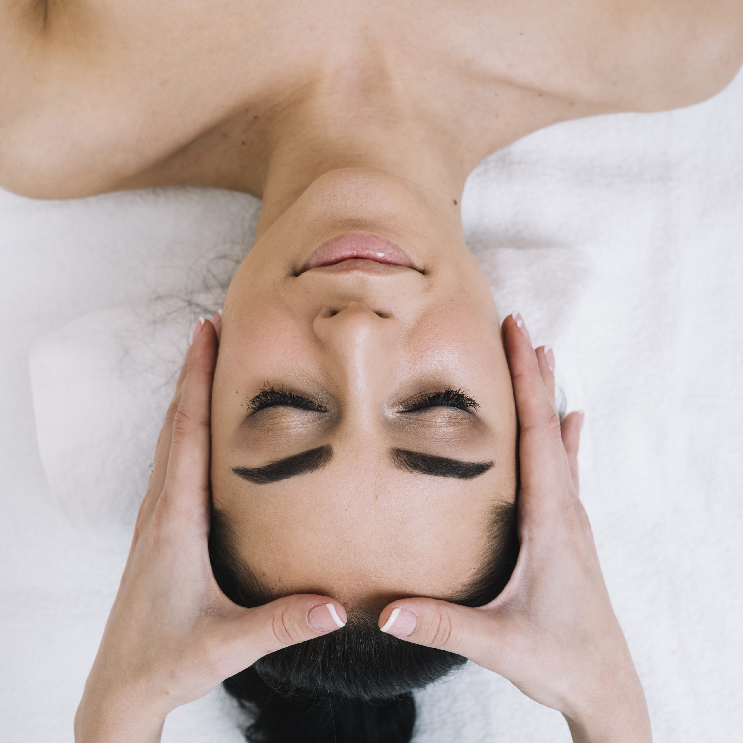 woman-receiving-relaxing-facial-massage